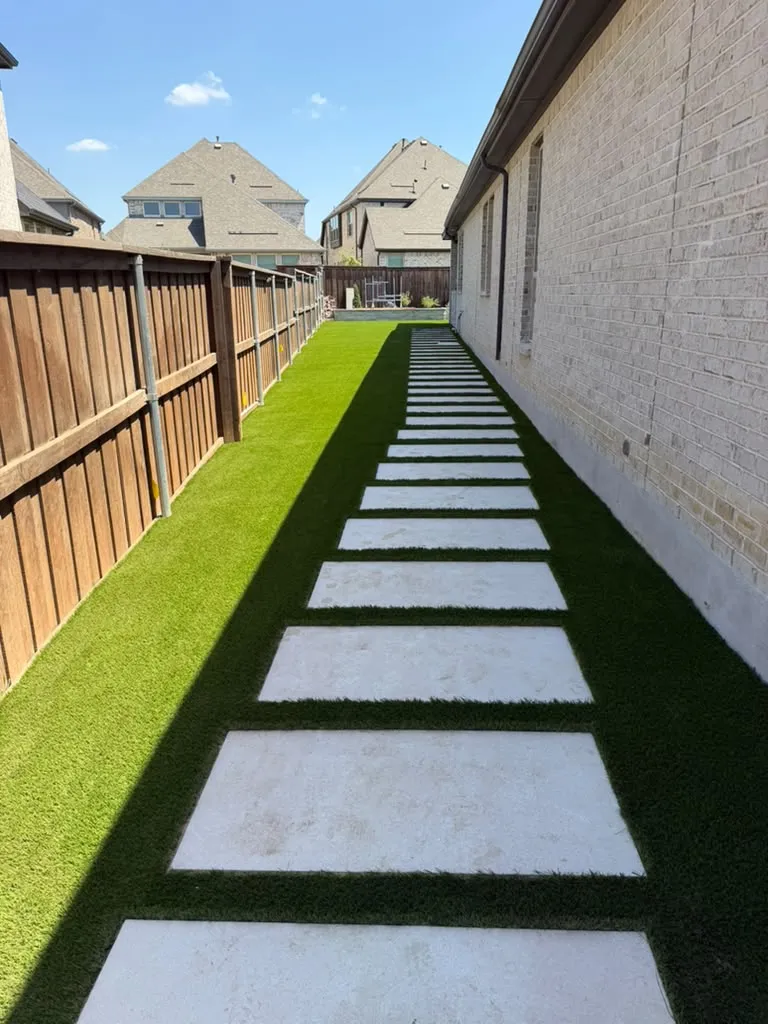 Artificial turf side yard with concrete stepping stones