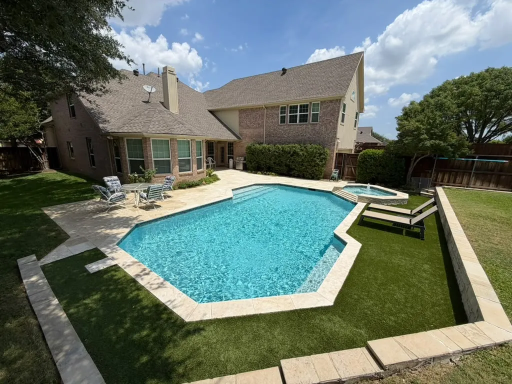 Complete backyard transformation with a swimming pool, spa, patio, and artificial turf